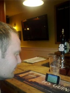 Glenn (not Glyn !) watching football on an Iphone.