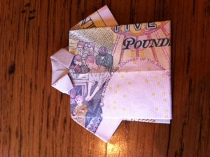 Miniature Origami shirt made from a £5 note.