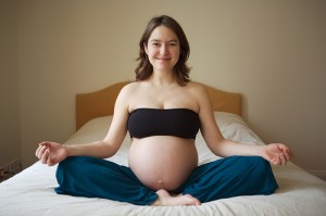 A pregnant woman with brown hair.