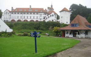 The main square on Caldey Island showing the Abbey and the Post office/Museum.