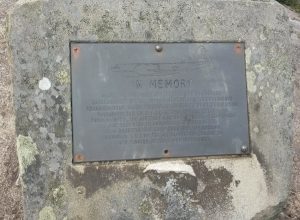 Steel plaque fastened to a rock.
