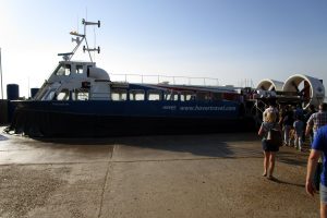 Some excited people boarding a Hovercraft