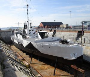 A grey and black metal warship from the 1st world war